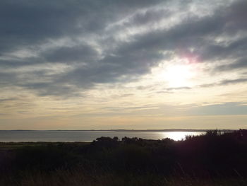 Scenic view of sea at sunset