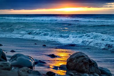 Scenic view of sea against sky during sunset