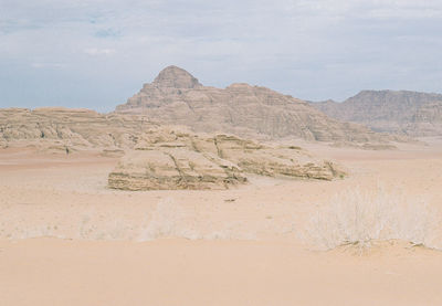 Scenic view of rock formations in desert against sky