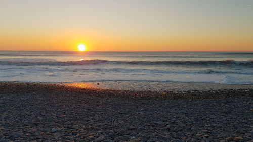 Scenic view of sea against sky during sunset