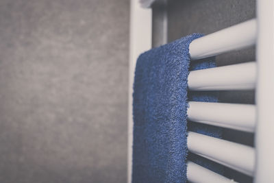 Towels heat up on a modern design radiator in the bathroom. closeup view of a towel ready to use