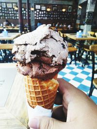 Hand holding ice cream cone