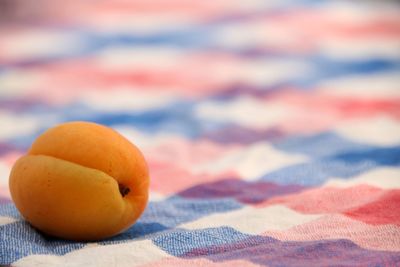 Close-up of apricot on table