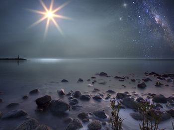 Digital composite image of lake against sky