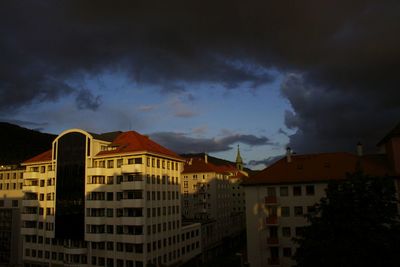 Panoramic view of residential district against dramatic sky