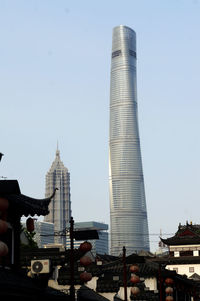 Low angle view of factory against clear sky