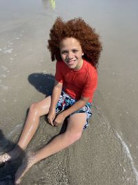 High angle view of girl playing at beach