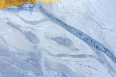 Full frame shot of snow on rock