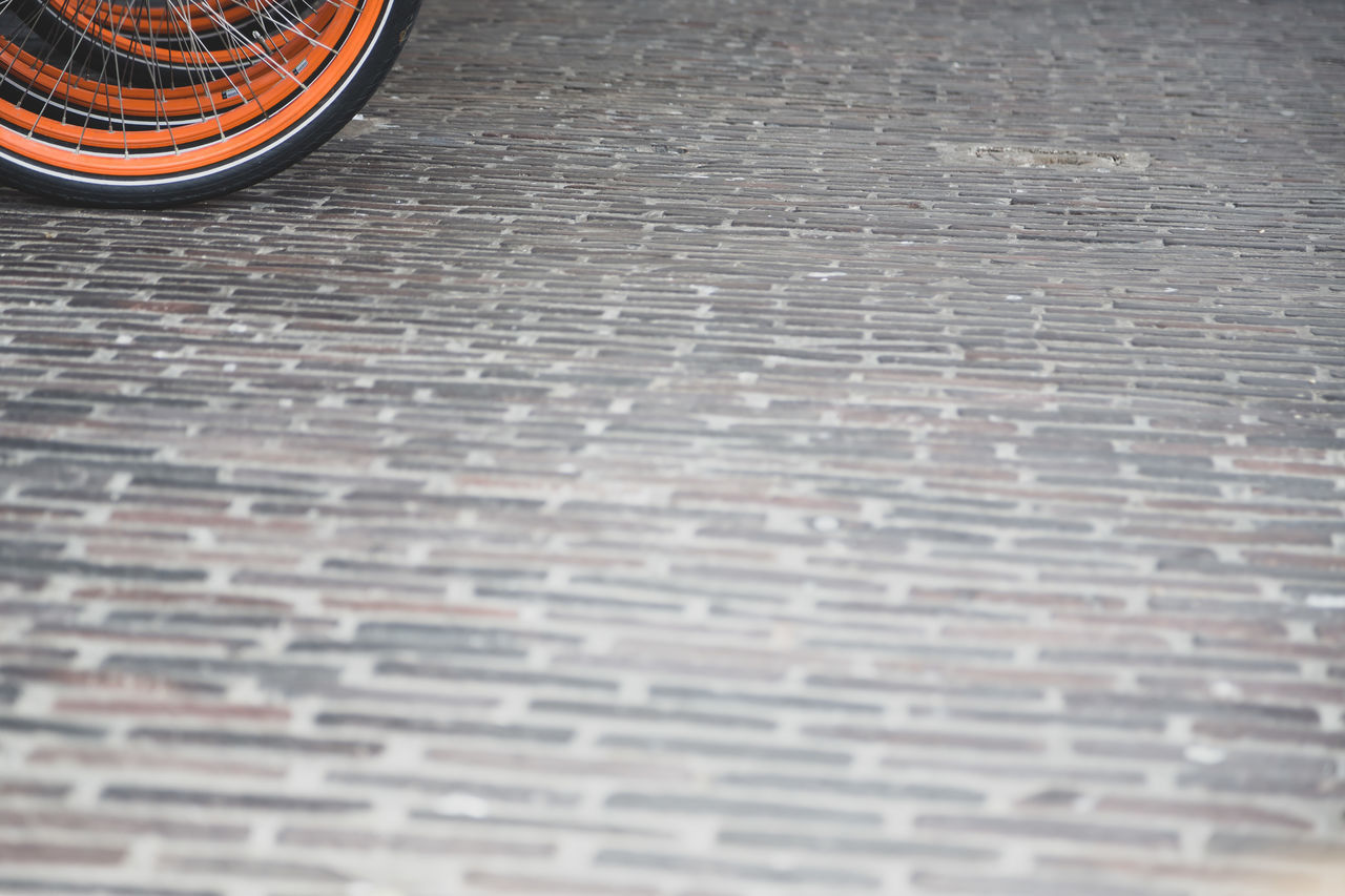 HIGH ANGLE VIEW OF COBBLESTONE STREET