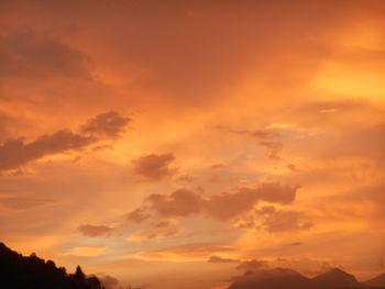 Low angle view of dramatic sky during sunset