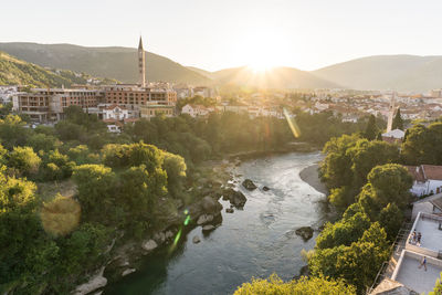 Bridge over river with city in background