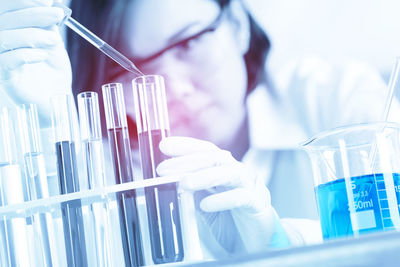 Female scientist holding medical sample at laboratory