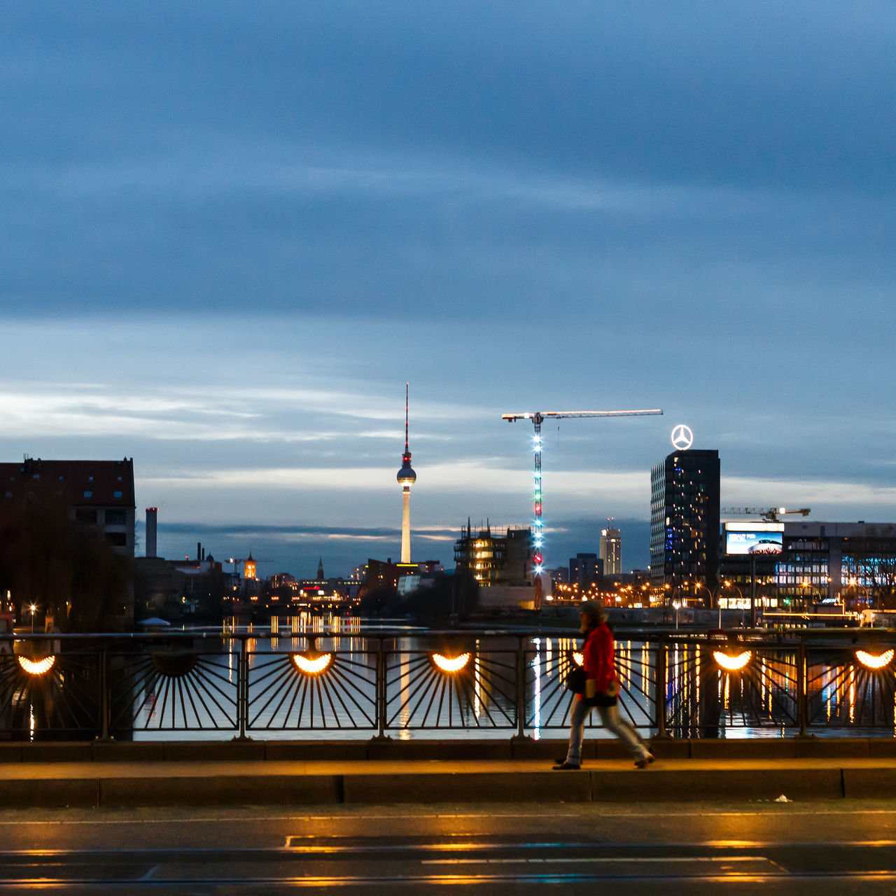 architecture, built structure, city, building exterior, sky, illuminated, cityscape, bridge - man made structure, cloud - sky, transportation, modern, city life, skyscraper, capital cities, railing, dusk, travel destinations, connection, night, road