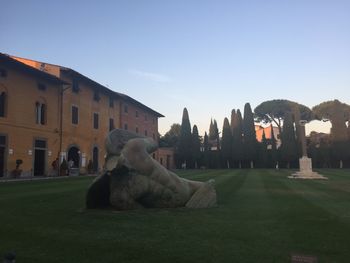 Statue of historic building against clear sky