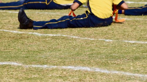 Low section of players playing on field