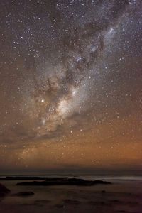 Scenic view of sea against sky at night