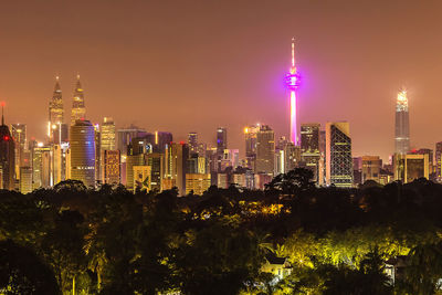 Illuminated buildings in city at night