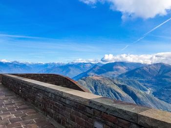 Scenic view of mountains against blue sky