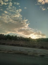 Scenic view of land against sky during sunset