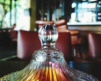 Close-up of glass bottle on table