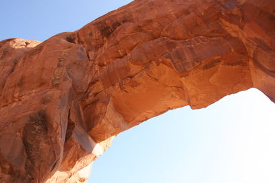 Low angle view of rock formation against clear sky