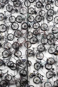 High angle view of various bicycles parked on snowcapped field during winter