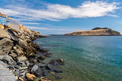 Scenic view of bay against sky