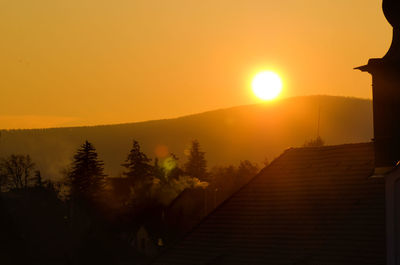 Scenic view of town during sunset
