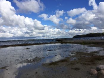 Scenic view of beach against sky