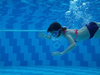 Woman swimming in pool