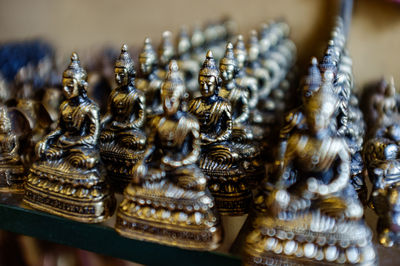 Close-up of buddha figurines for sale in shop