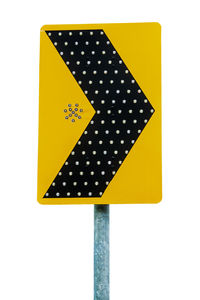 Close-up of yellow sign on white background