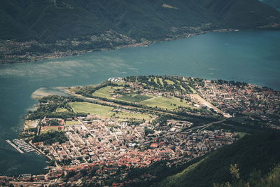 High angle view of townscape by river in city