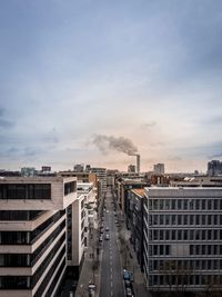 High angle view of road amidst buildings against sky