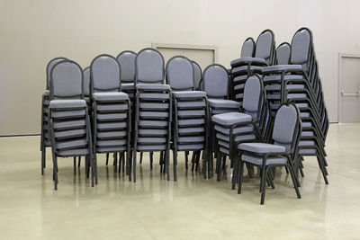 Empty chairs and tables in row