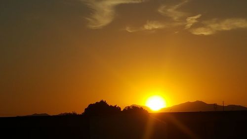 Scenic view of landscape against sky during sunset