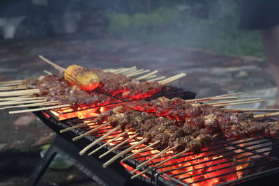 Meat cooking on barbecue grill