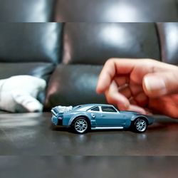 Close-up of hand holding toy car