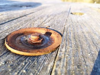 High angle view of rusty metal on bench