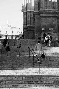 People on cobblestone street