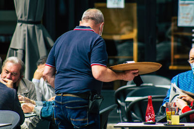 People sitting on chair at table
