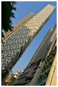 Low angle view of built structure against blue sky