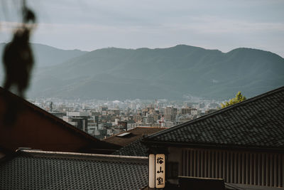 Buildings in city against sky