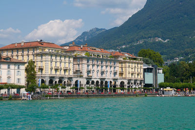 Beautiful view of some old buildings of lugano switzerland seen from the lake on  summer