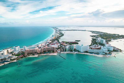 High angle view of sea and bay against sky