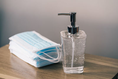 Close-up of glass bottle on table