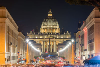 Illuminated buildings in city at night