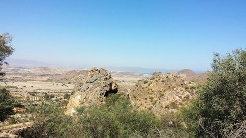 Scenic view of landscape against clear blue sky