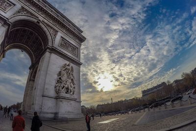Low angle view of historical building against cloudy sky
