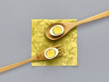 High angle view of bread on table against white background